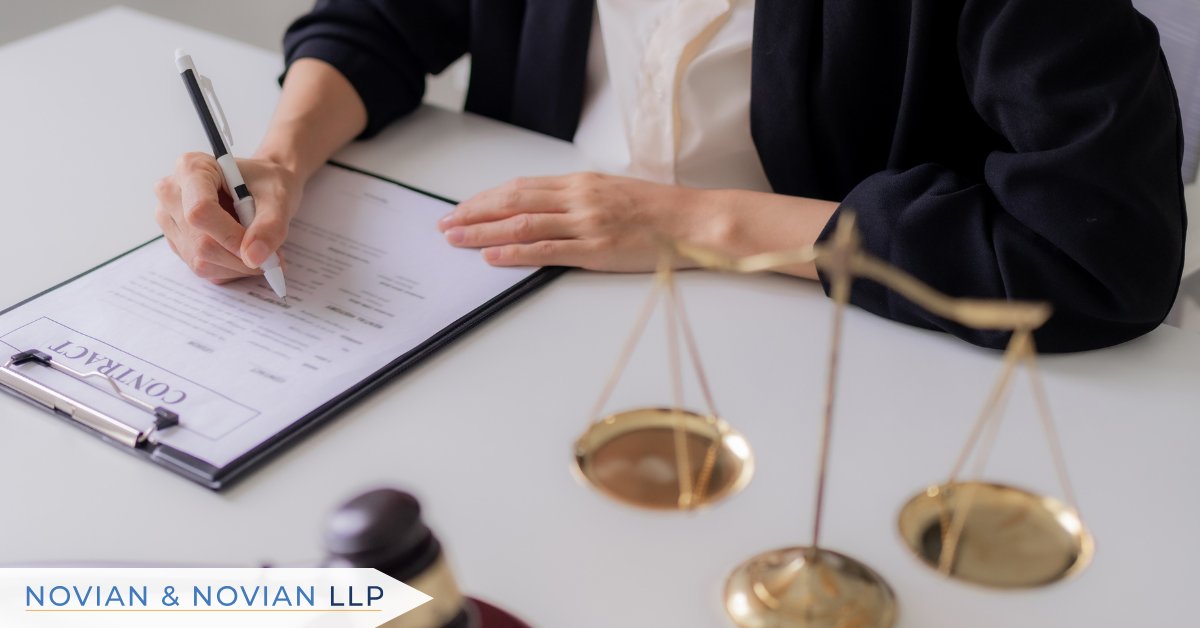 An attorney reviews and signs legal documents beside the scales of justice, representing how employers assess what makes an EEOC complaint successful and prepare their defense.